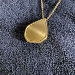 Necklace with gold tone chain & pendant